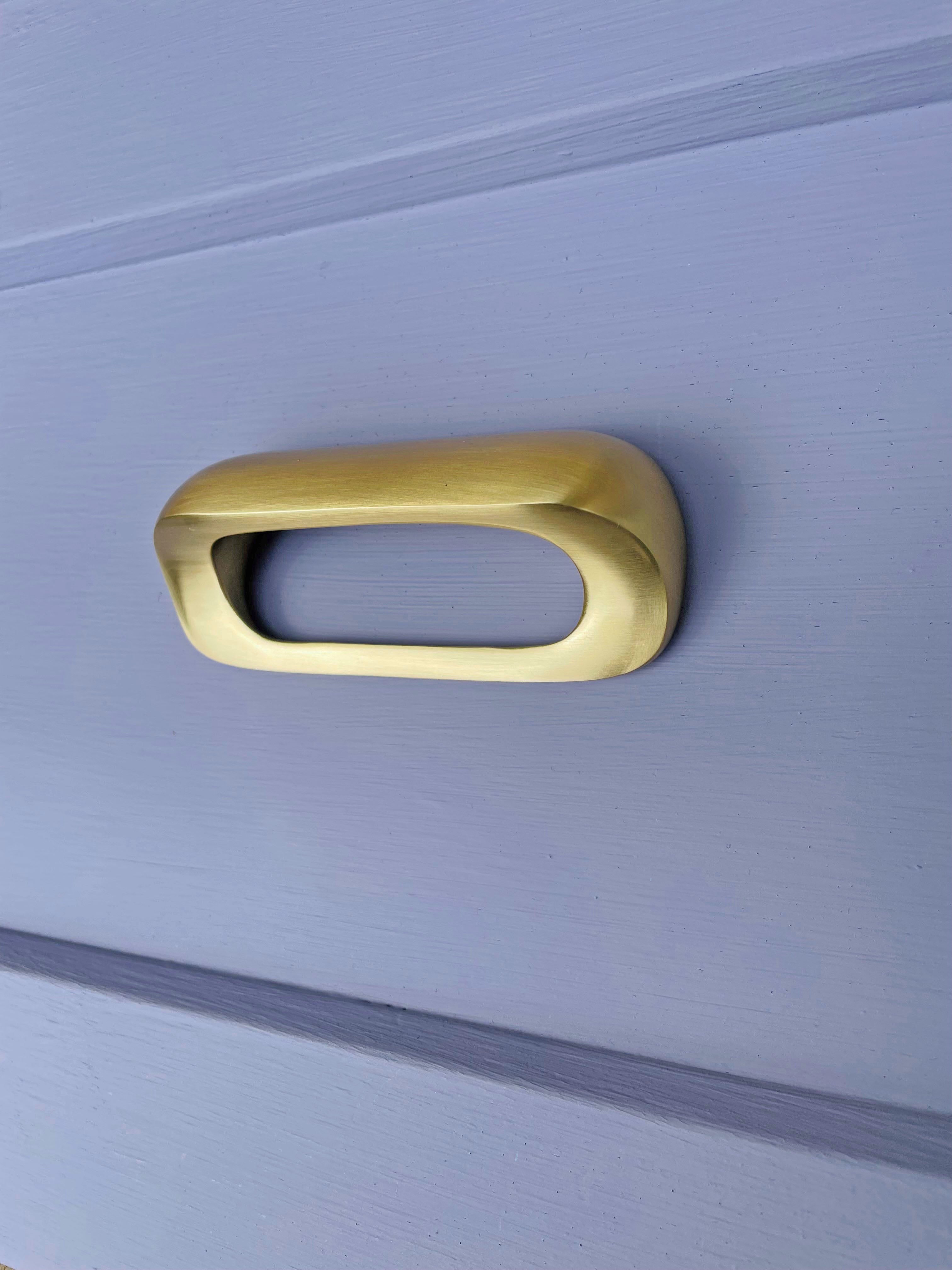 inspired by mid century curves this beautiful cup pull is perfect for kitchen cabinets